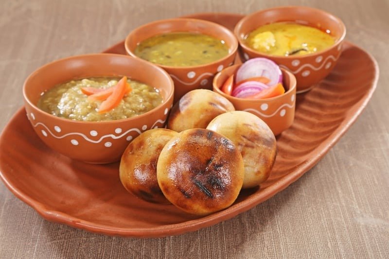 A traditional plate of Litti Chokha, the signature rustic dish of Bihar, served with ghee
